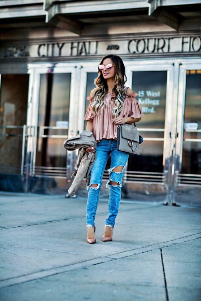 fashion blogger mia mia mine wearing lovers + friends jeans from revolve and a pink top from shopbop