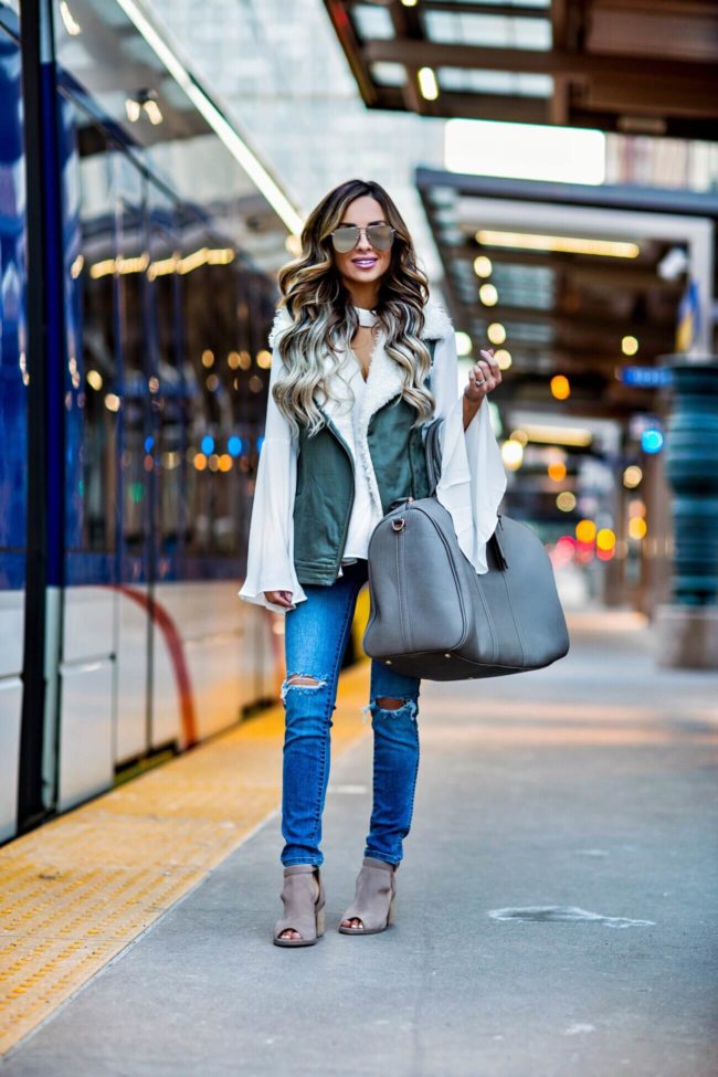 mia mia mine wearing sole society booties and a weekender bag