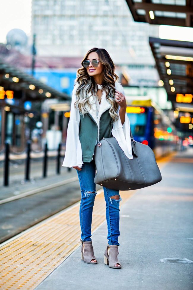 fashion blogger mia mia mine carrying a weekender bag from sole society and booties