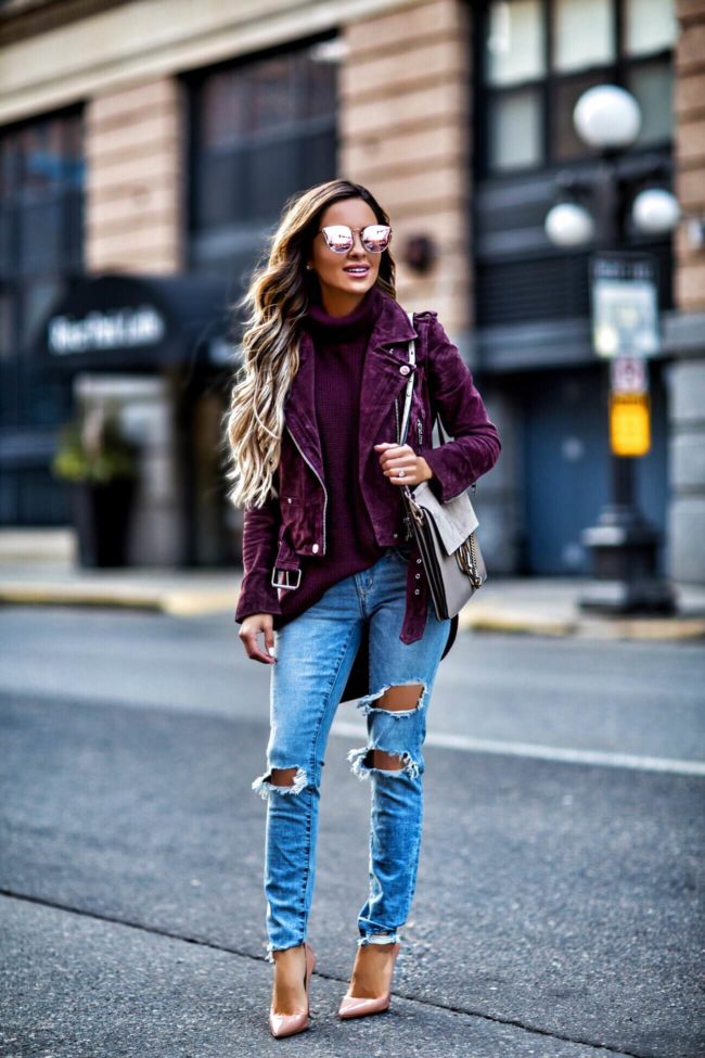 mn fashion blogger mia mia mine wearing a suede jacket and ripped jeans from revolve