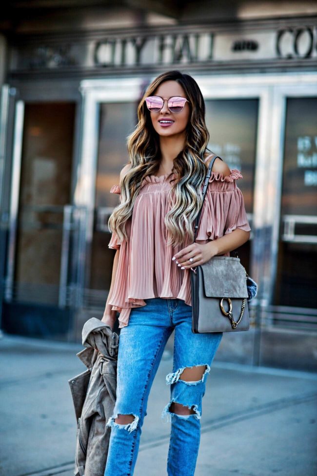 fashion blogger mia mia mine wearing pink sunglasses by quay and a pink off-the-shoulder top from revolve