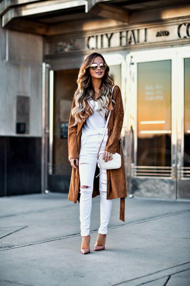 mn fashion blogger mia mia mine carrying a gucci marmont bag and wearing a bb dakota suede coat