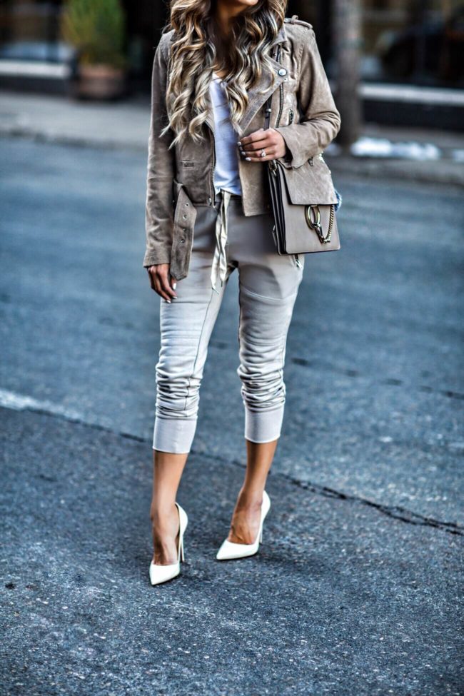 fashion blogger mia mia mine wearing sincerely jules gray jogger pants and christian louboutin so kate white heels from neiman marcus