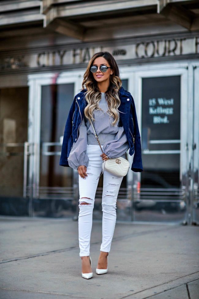 mn fashion blogger mia mia mine wearing a striped top from bebe and white topshop jeans
