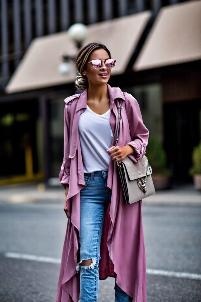 mn fashion blogger mia mia mine wearing a pink trench coat and ripped jeans from revolve by lovers + friends
