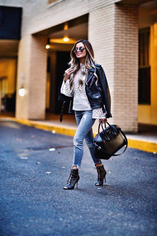 fashion blogger mia mia mine wearing a lace top from nordstrom and a leather jacket