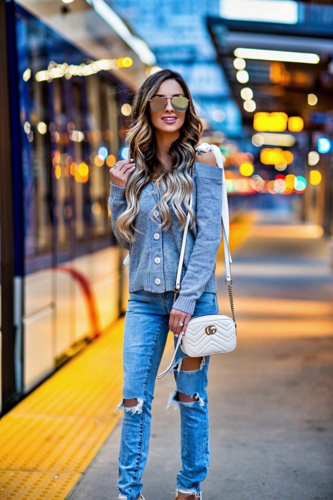 fashion blogger mia mia mine wearing a tie shoulder cardigan from shopbop and lovers + friends jeans from revolve