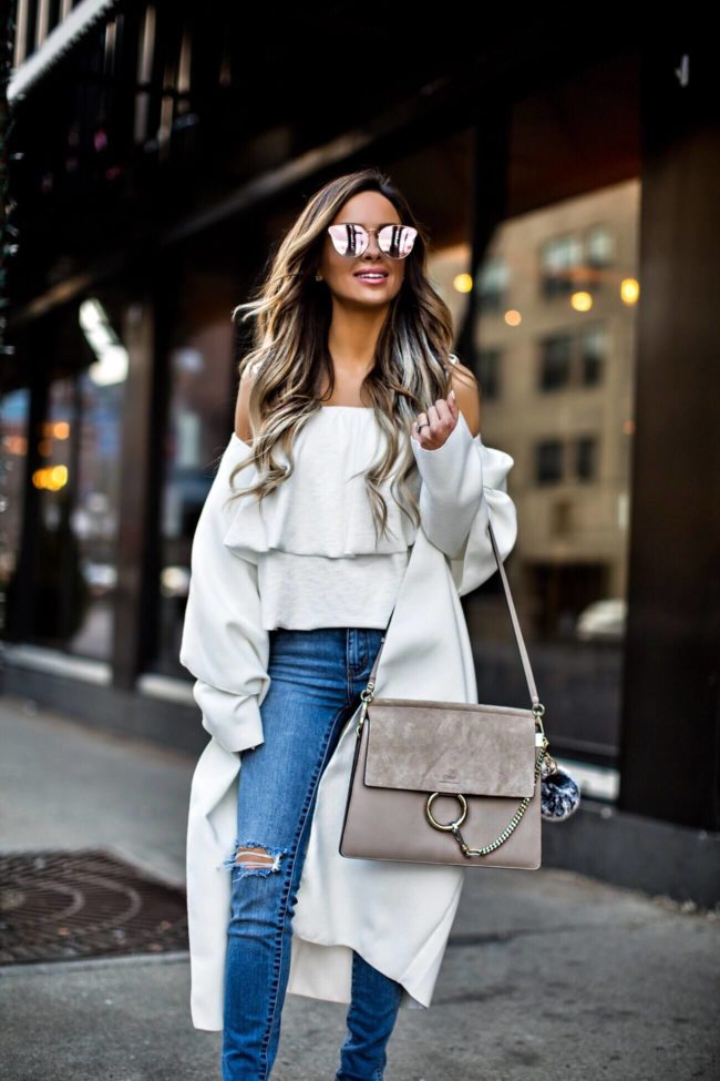 fashion blogger mia mia mine wearing a white coat for spring by missguided