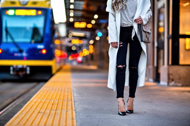 fashion blogger mia mia mine wearing a white coat and striped tee from Shopbop