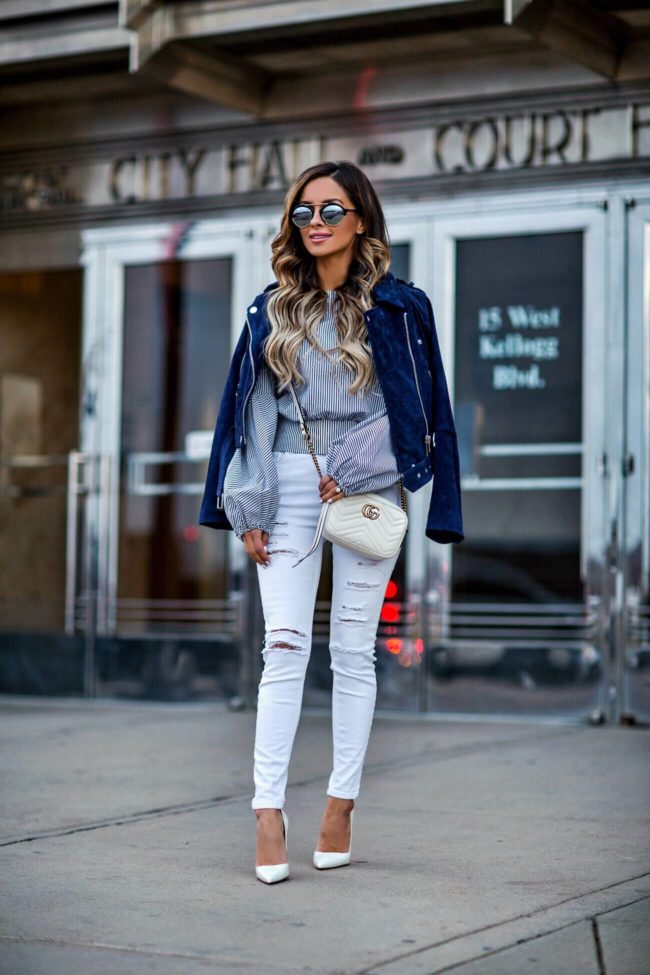 fashion blogger mia mia mine wearing a striped top from bebe and a blanknyc suede jacket from nordstrom
