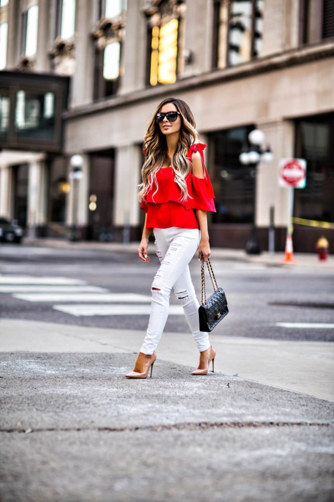 fashion blogger mia mia mine wearing a bright red bow top by amanda richard from shopbop