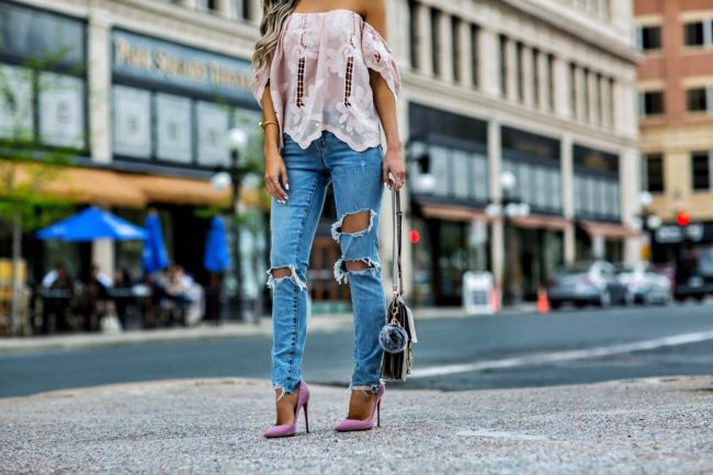 fashion blogger mia mia mine wearing a pink lace lovers + friends top and lovers + friends ripped jeans