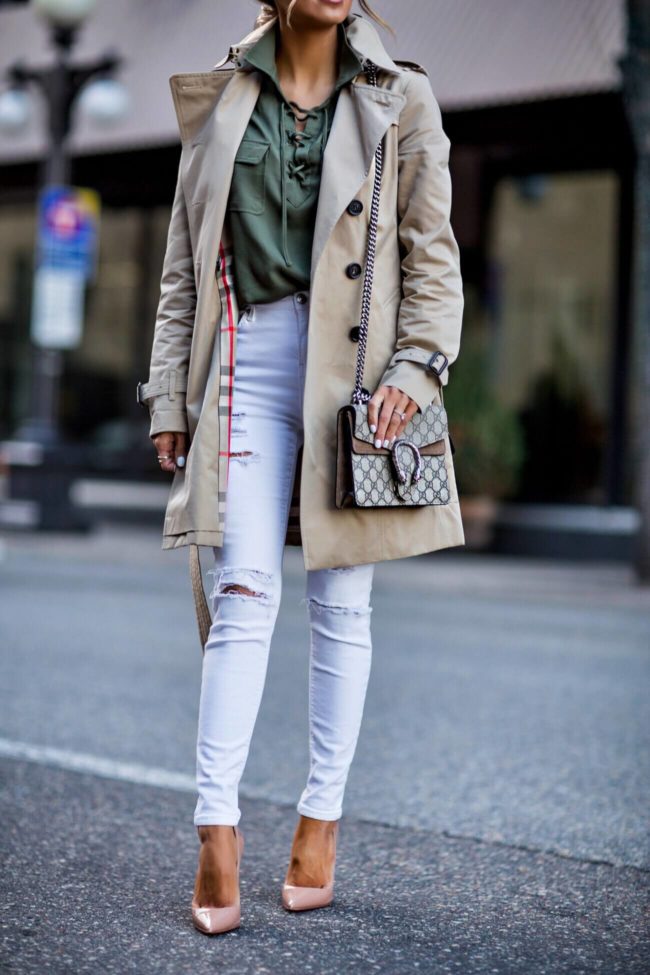 fashion blogger mia mia mine wearing a burberry trench coat and a gucci dionysus bag