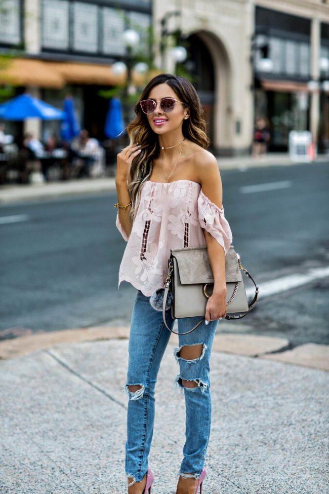 fashion blogger mia mia mine wearing a pink lace lovers + friends top and a chloe faye medium bag