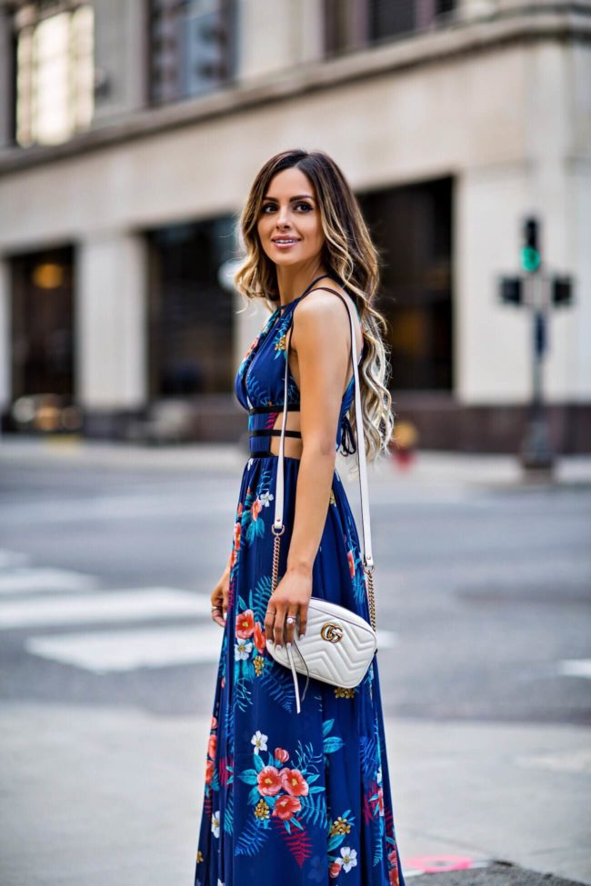 mn fashion blogger mia mia mine wearing a blue floral dress from express