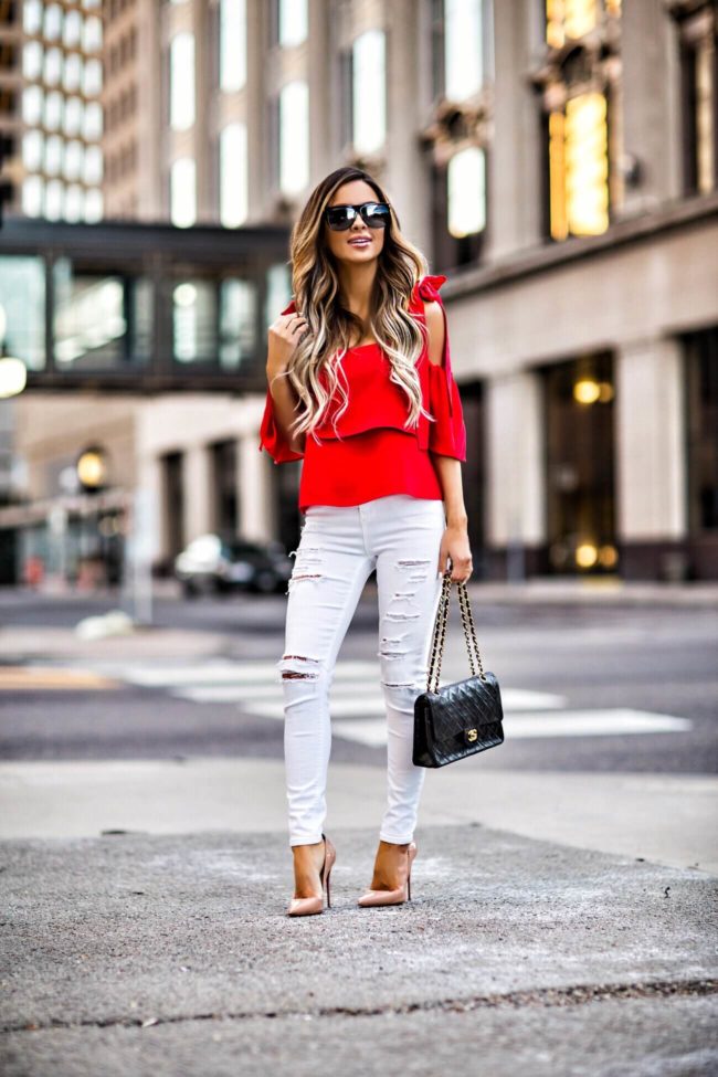 mn fashion blogger mia mia mine wearing a bright red top by amanda uprichard from shopbop and white topshop jeans