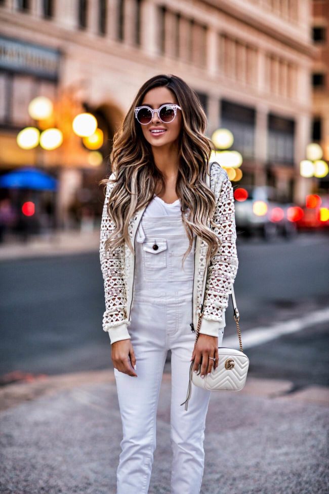 mn fashion blogger mia mia mine wearing white free people overalls and a lace bomber jacket from shopbop