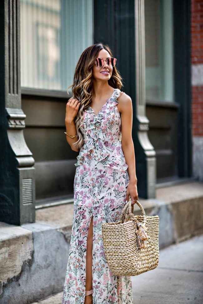 mn fashion blogger mia mia mine wearing a pink floral dress from topshop and a straw tote from shopbop