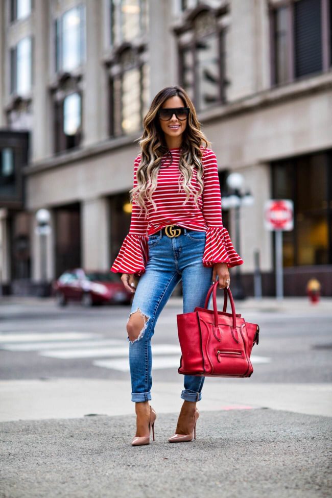 fashion blogger mia mia mine wearing a bell sleeve red stripe from shopbop and a red celine bag