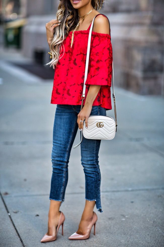 mn fashion blogger mia mia mine wearing a red lace top and gucci marmont bag