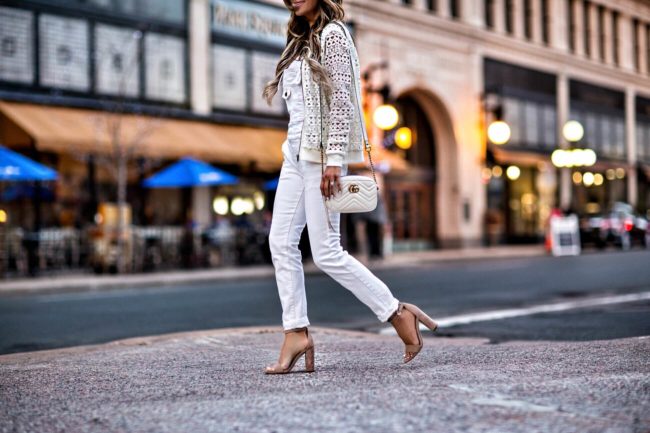 fashion blogger mia mia mine wearing white overalls from free people and a white gucci marmont bag