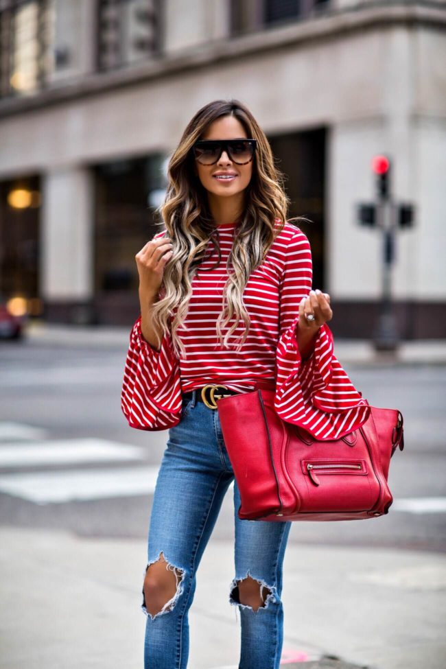 fashion blogger mia mia mine wearing a gucci double g buckle belt and a red celine bag