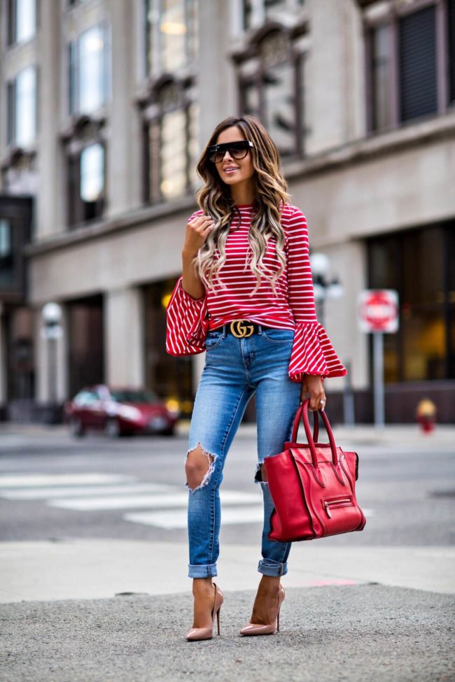 mn fashion blogger mia mia mine wearing a red striped top and levi's distressed jeans from shopbop