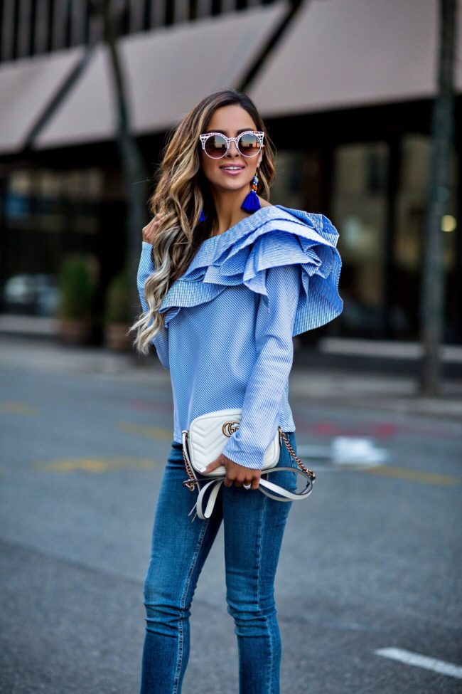 fashion blogger mia mia mine wearing a ruffled one shoulder top from shopbop's event of the season sale 2017