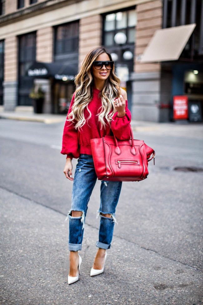 mn fashion blogger mia mia mine wearing a red off-the-shoulder sweatshirt from nordstrom and a red celine bag for spring