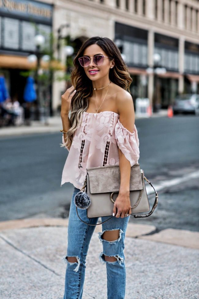 fashion blogger mia mia mine wearing a lovers + friends pink lace top and chloe faye bag