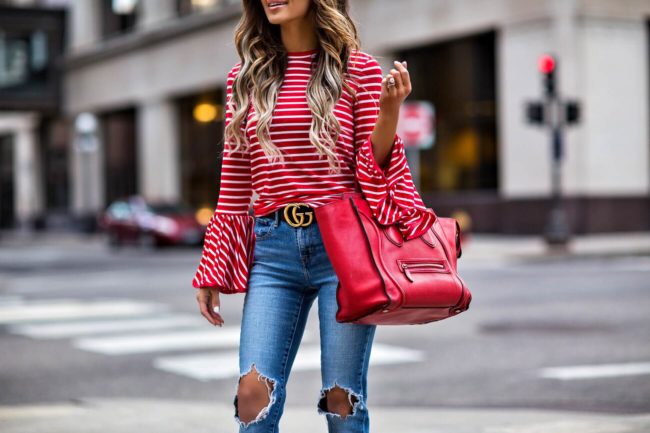 fashion blogger mia mia mine wearing a striped red bell sleeve top from shopbop and a red celine luggage tote