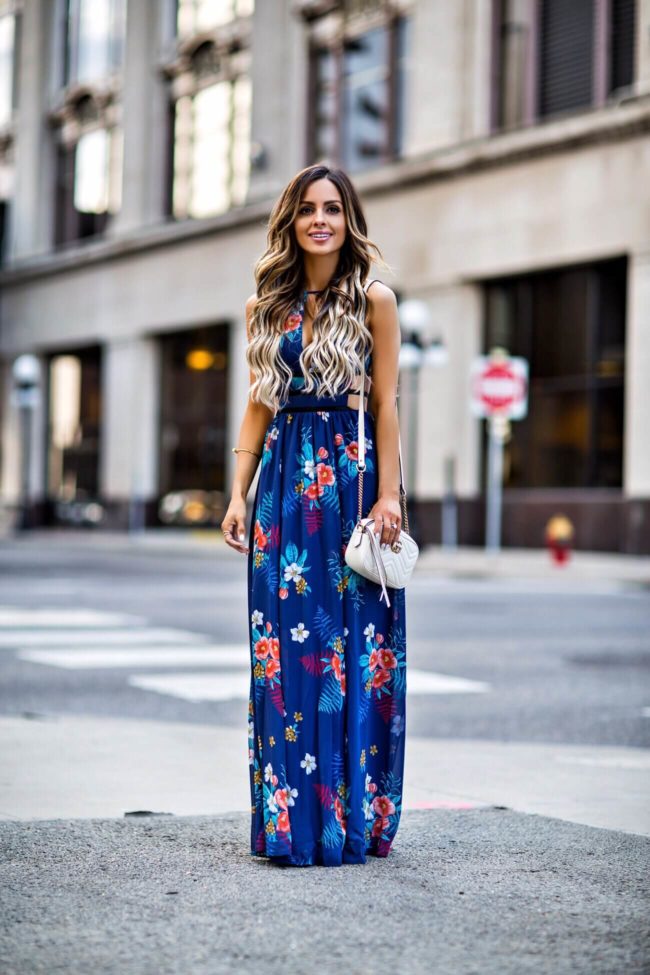 fashion blogger mia mia mine wearing a blue floral maxi dress from express