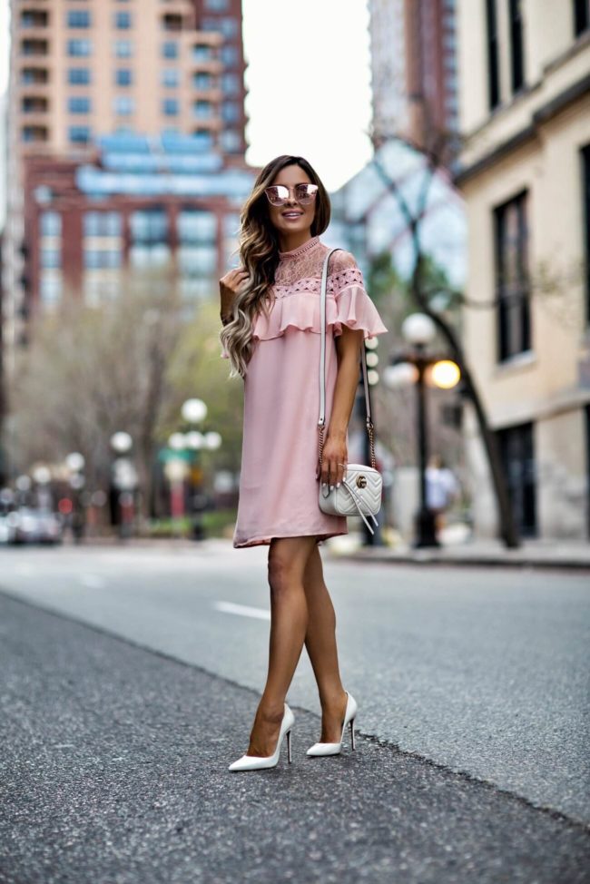 fashion blogger mia mia mine wearing a pink lace dress from express for spring