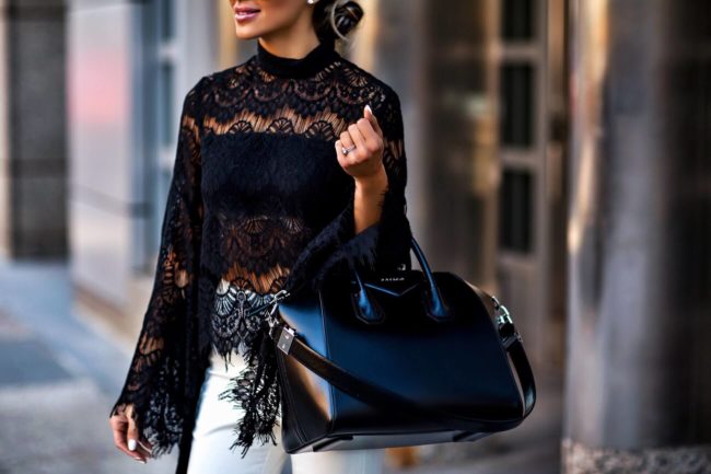fashion blogger mia mia mine wearing a black lace top from revolve and a givenchy bag from nordstrom