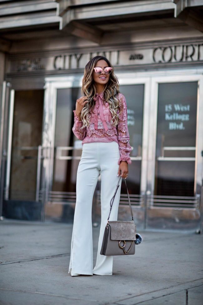 fashion blogger mia mia mine wearing a pink lace top from shopbop and pink quay sunglasses
