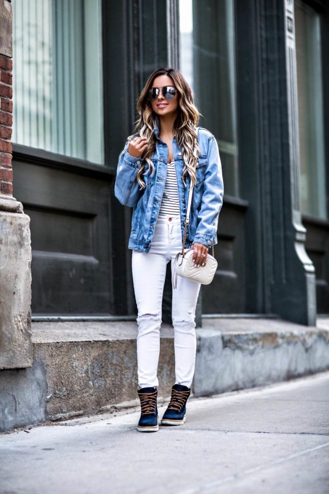 fashion blogger mia mia mine wearing a gucci bag and timberland boots