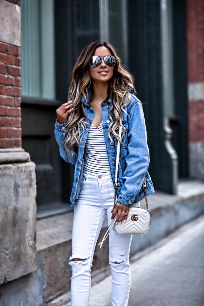 fashion blogger mia mia mine wearing a denim topshop jacket and a gucci bag