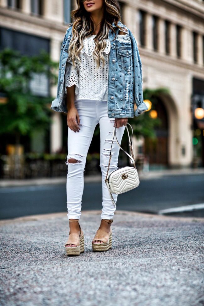 fashion blogger mia mia mine wearing a denim studded jacket from topshop and chloe wedges 