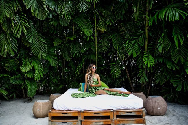 fashion blogger mia mia mine wearing a palm print dress at the modern honolulu hawaii