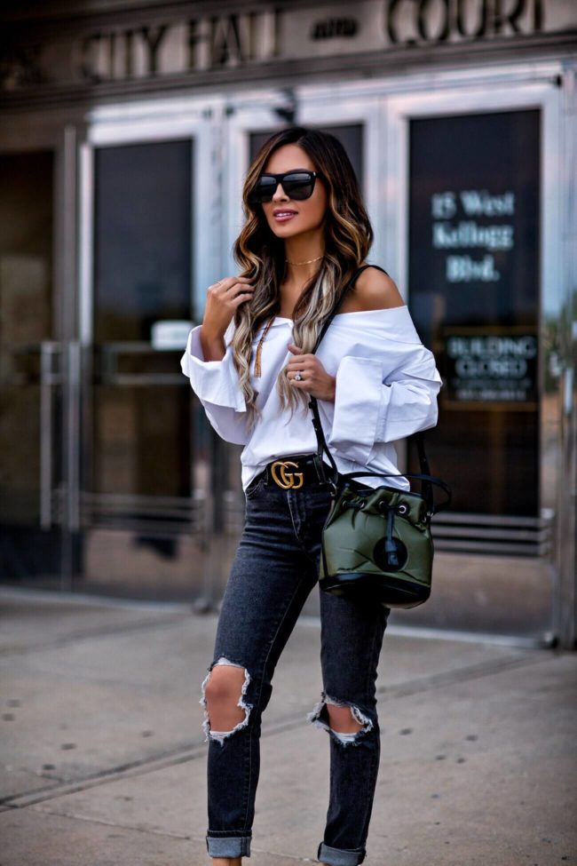 fashion blogger mia mia mine in a white button down top and a gucci belt