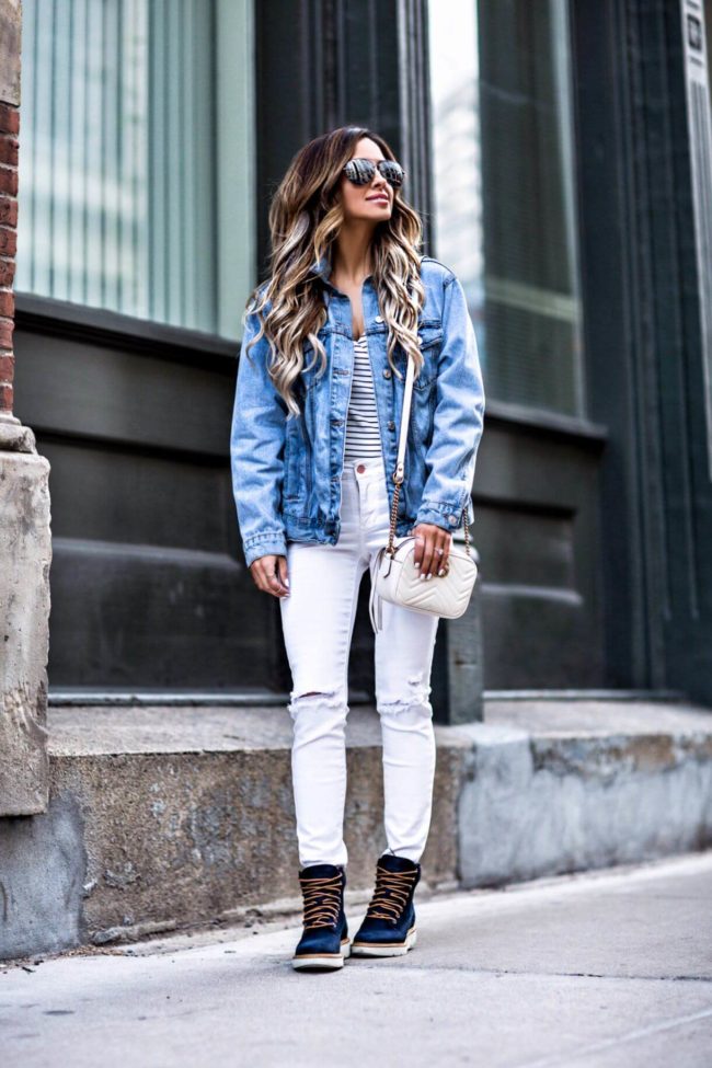 fashion blogger mia mia mine wearing a topshop denim jacket and white jeans