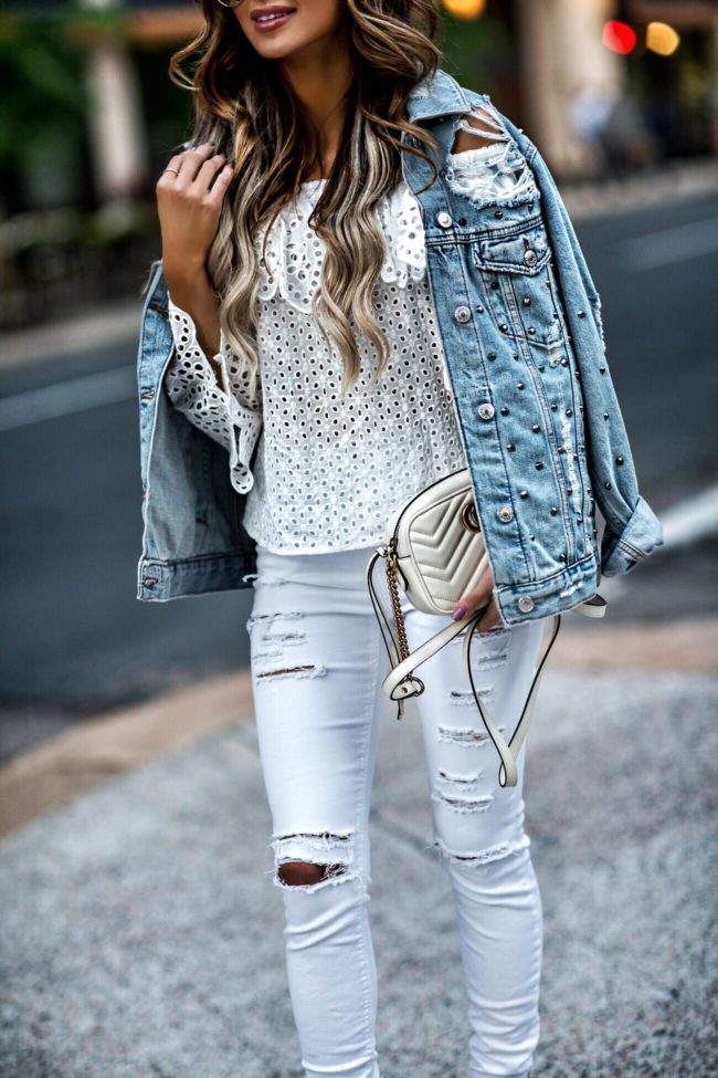 fashion blogger mia mia mine wearing a white eyelet top and a topshop studded jacket from nordstrom