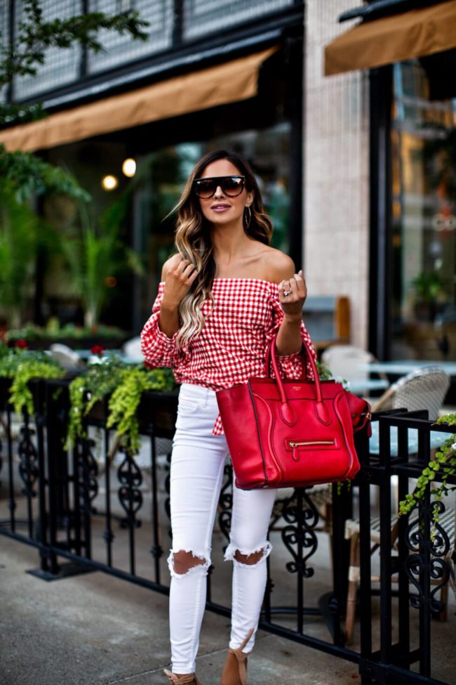 fashion blogger mia mia mine wearing celine sunglasses and a red celine bag