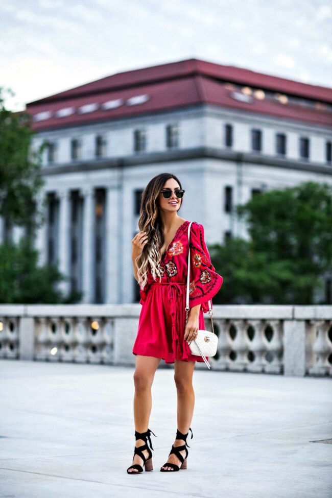 fashion blogger mia mia mine wearing a red dress by free people from macy's