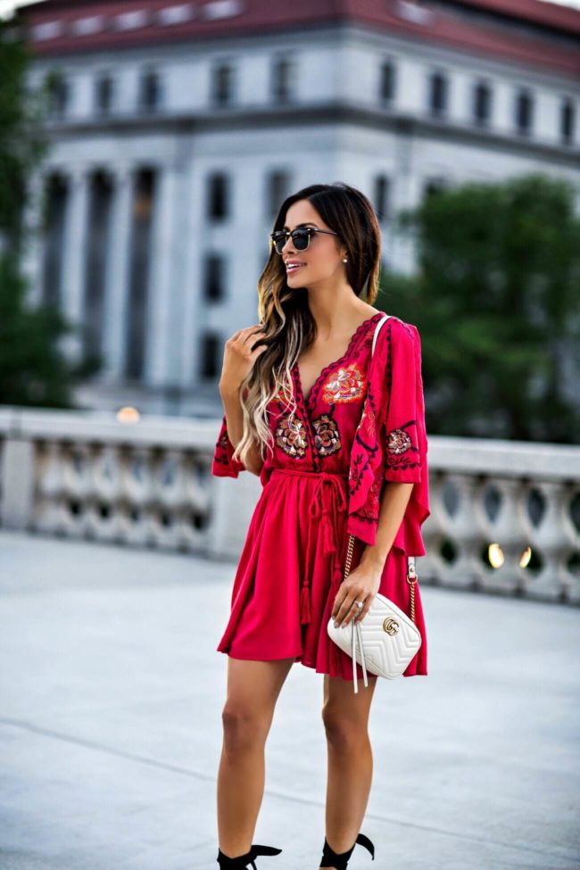 fashion blogger mia mia mine wearing an embroidered red dress from macy's and a gucci marmont bag