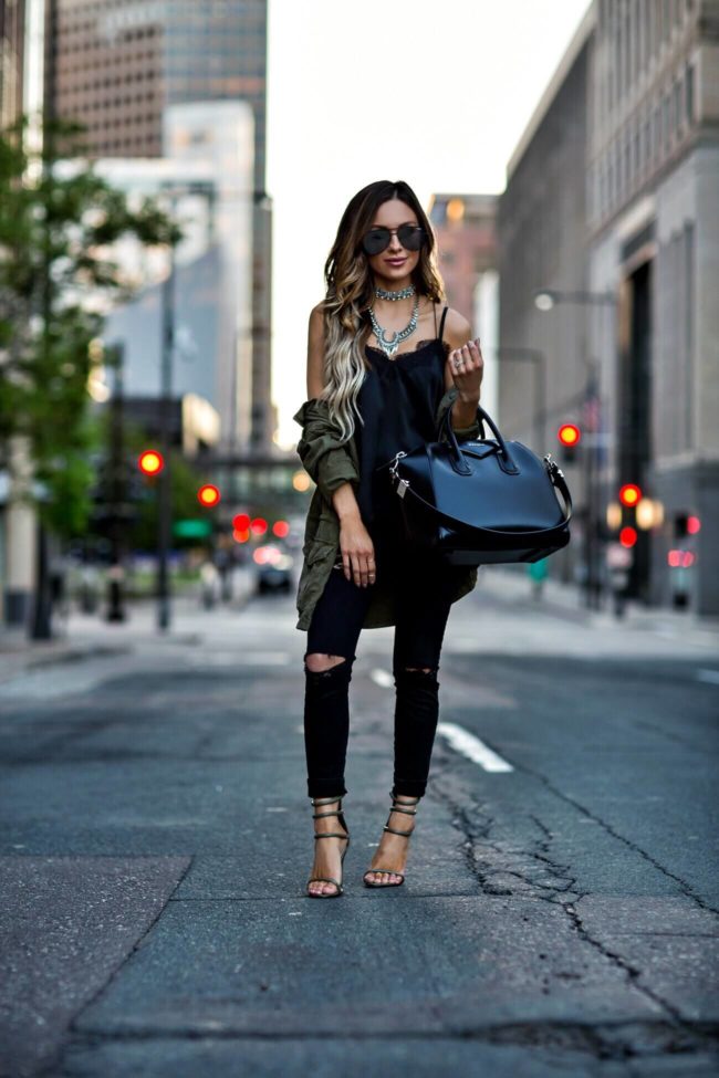fashion blogger mia mia mine wearing a utility jacket and a givenchy bag 
