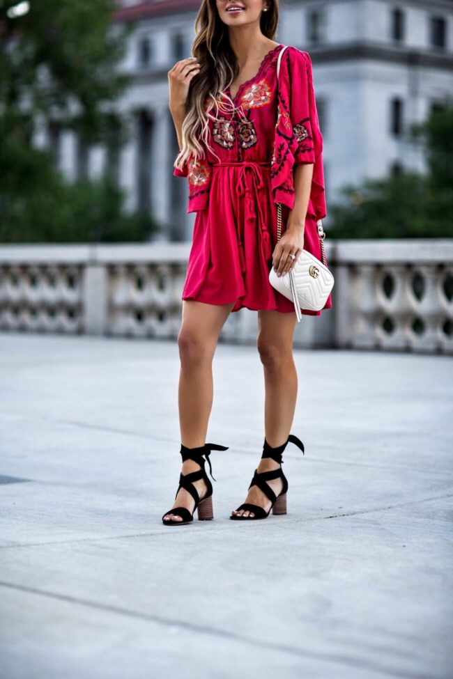 fashion blogger mia mia mine wearing lace-up vince camuto heels and an embroidered free people dress from macy's