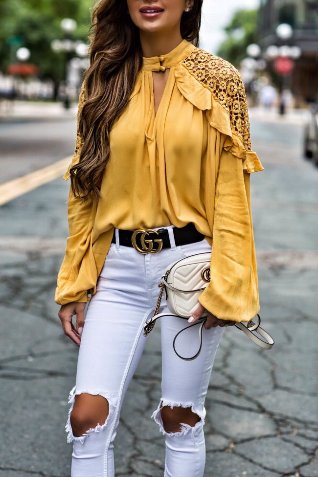 fashion blogger mia mia mine wearing a yellow free people top and white free people denim from macy's