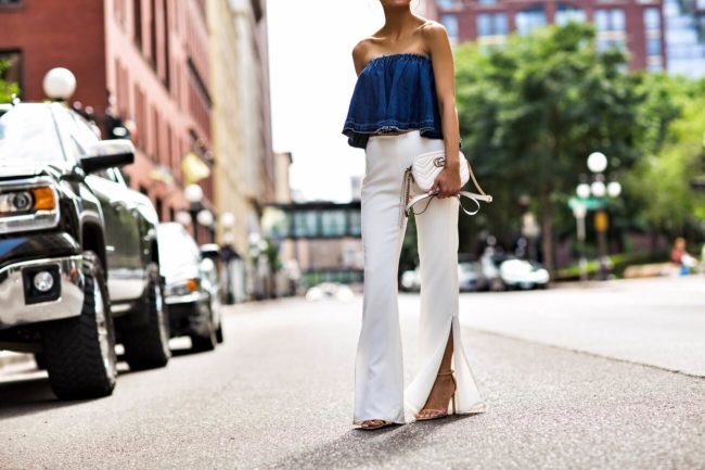 fashion blogger mia mia mine wearing a denim off-the-shoulder top and white pants from nordstrom