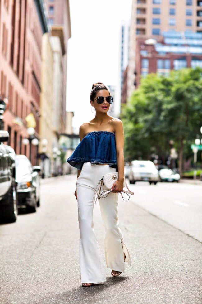 fashion blogger mia mia mine wearing a denim strapless top from nordstrom and a gucci marmont mini bag